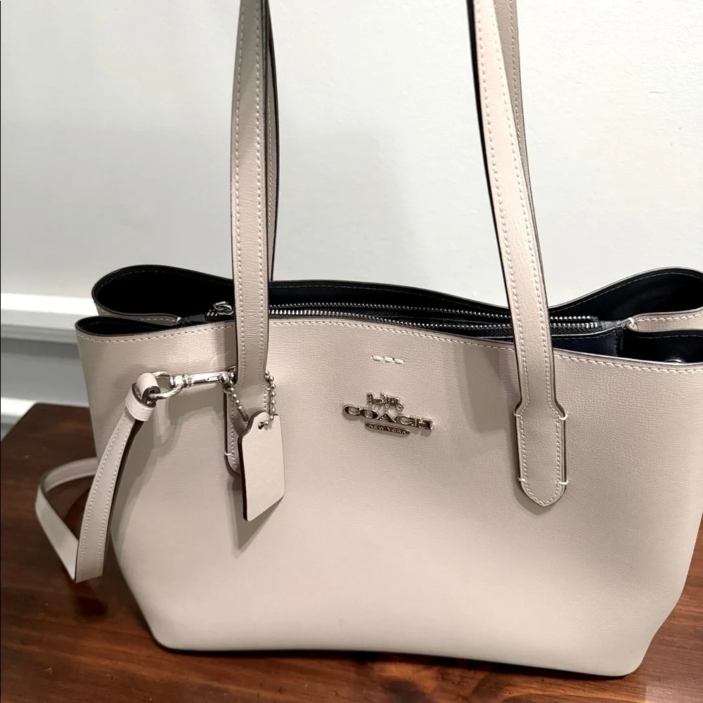 Large Coach handbag.  Purple/ grey color